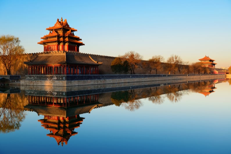 Imperial Palace over lake in the morning in Beijing.