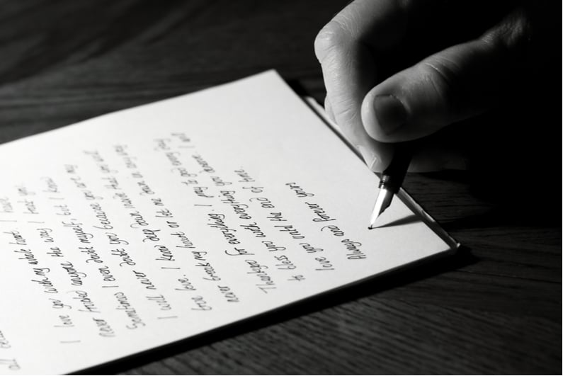 Hand writing a letter