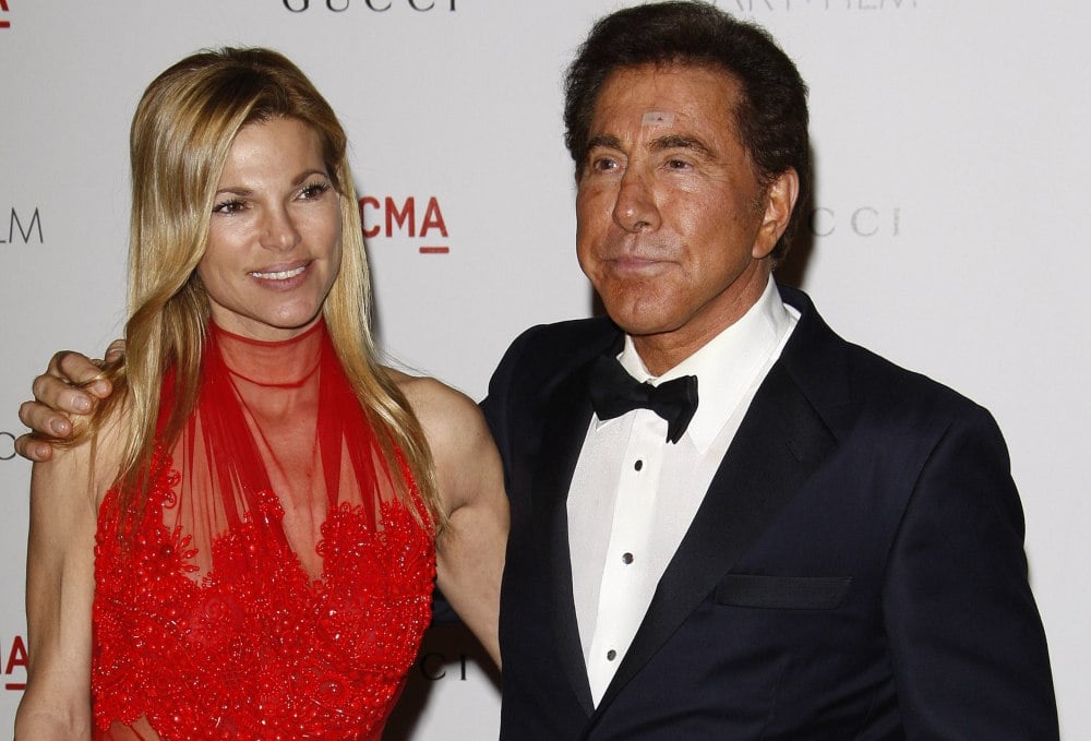 Wynn Resorts founder Steve Wynn posing for photo with woman