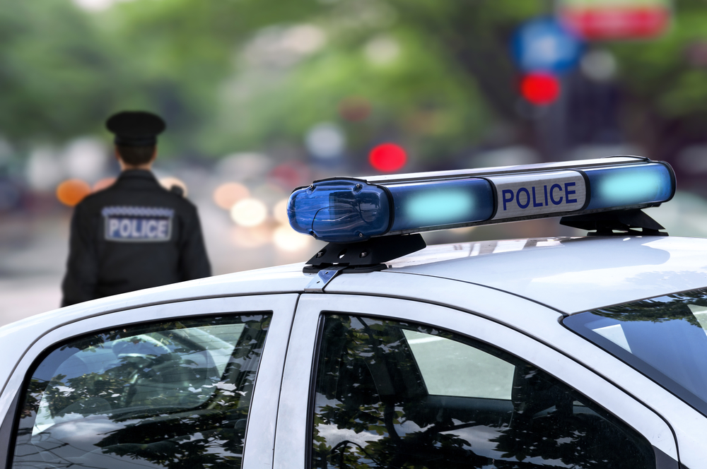 police car and police officer in the background