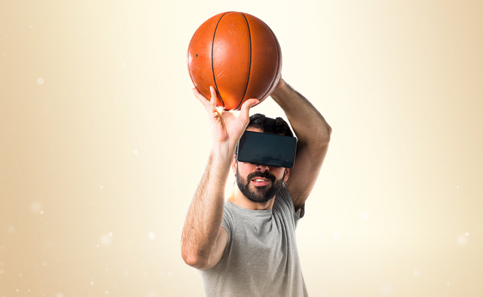 man playing basketball using VR glasses