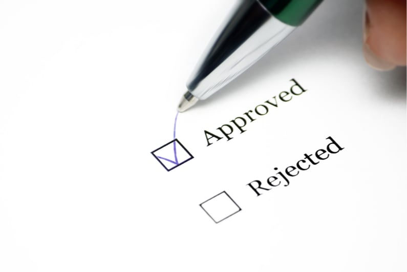 pen ticking approved box