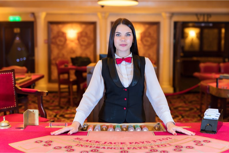 Female live blackjack dealer