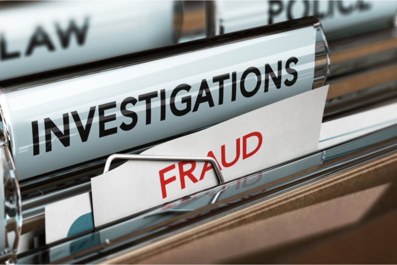 File folders labeled "FRAUD" and "INVESTIGATIONS"