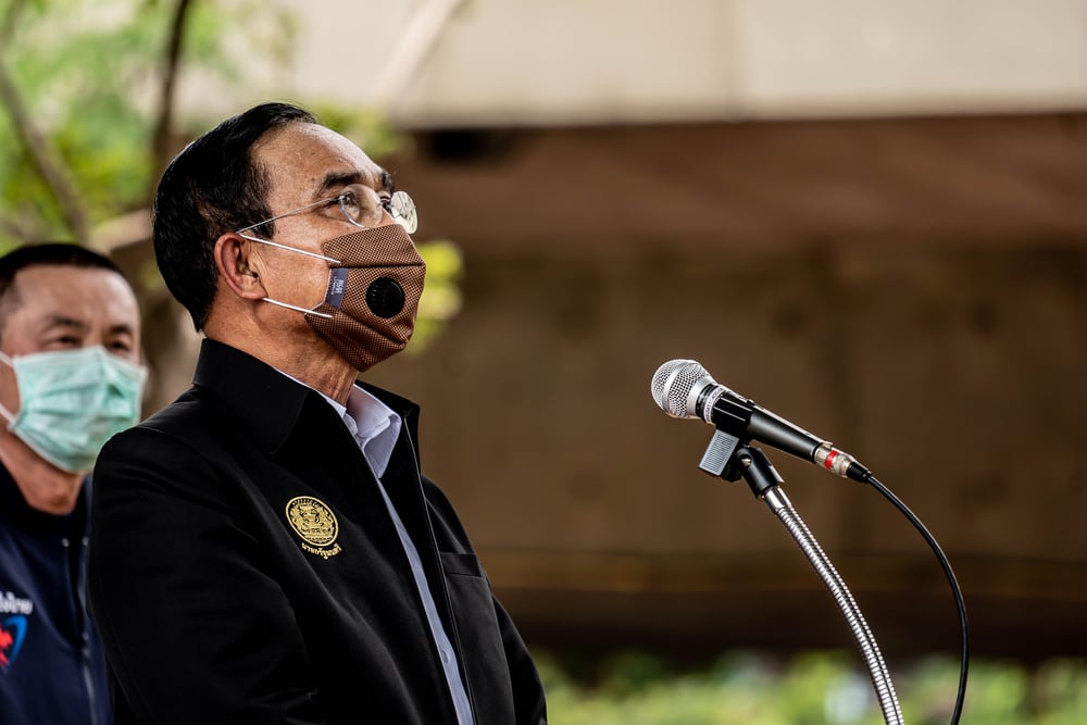 Thailand Prime Minister Prayut Chan-o-cha giving a speech in a face mask