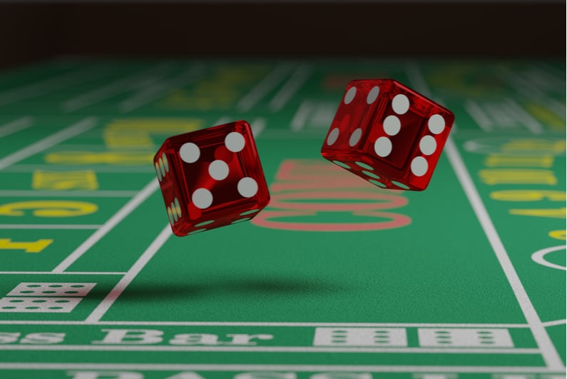 dice tumbling on craps table