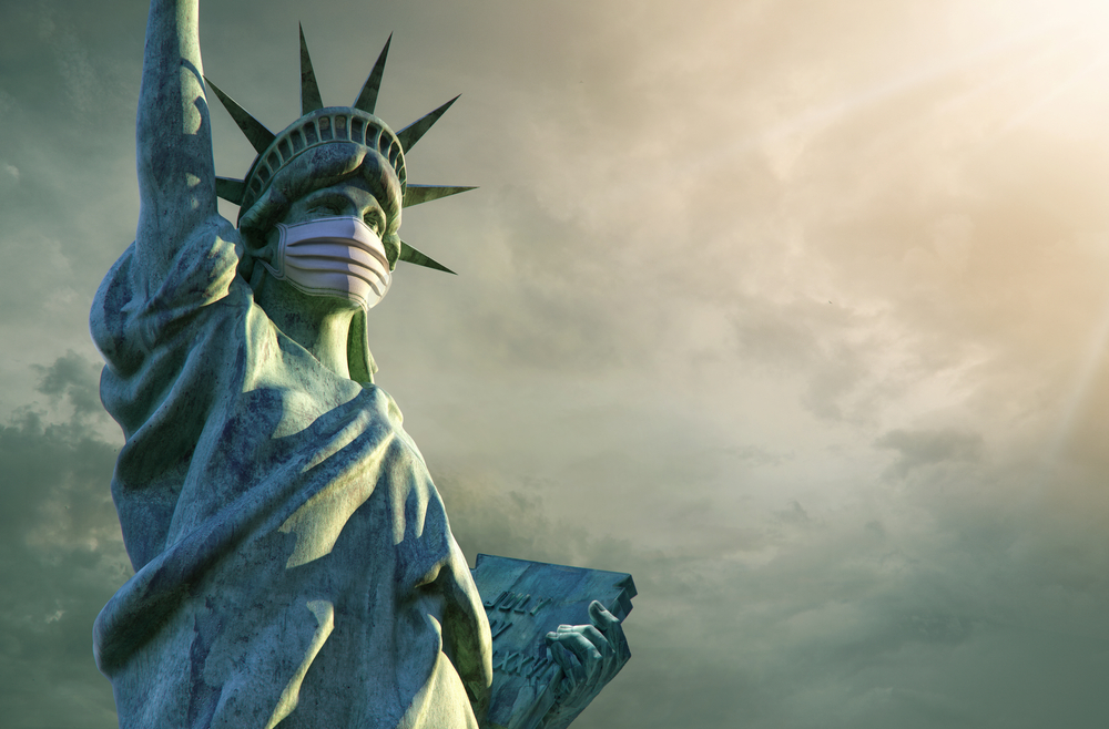 masked Statue of Liberty against overcast sky backdrop